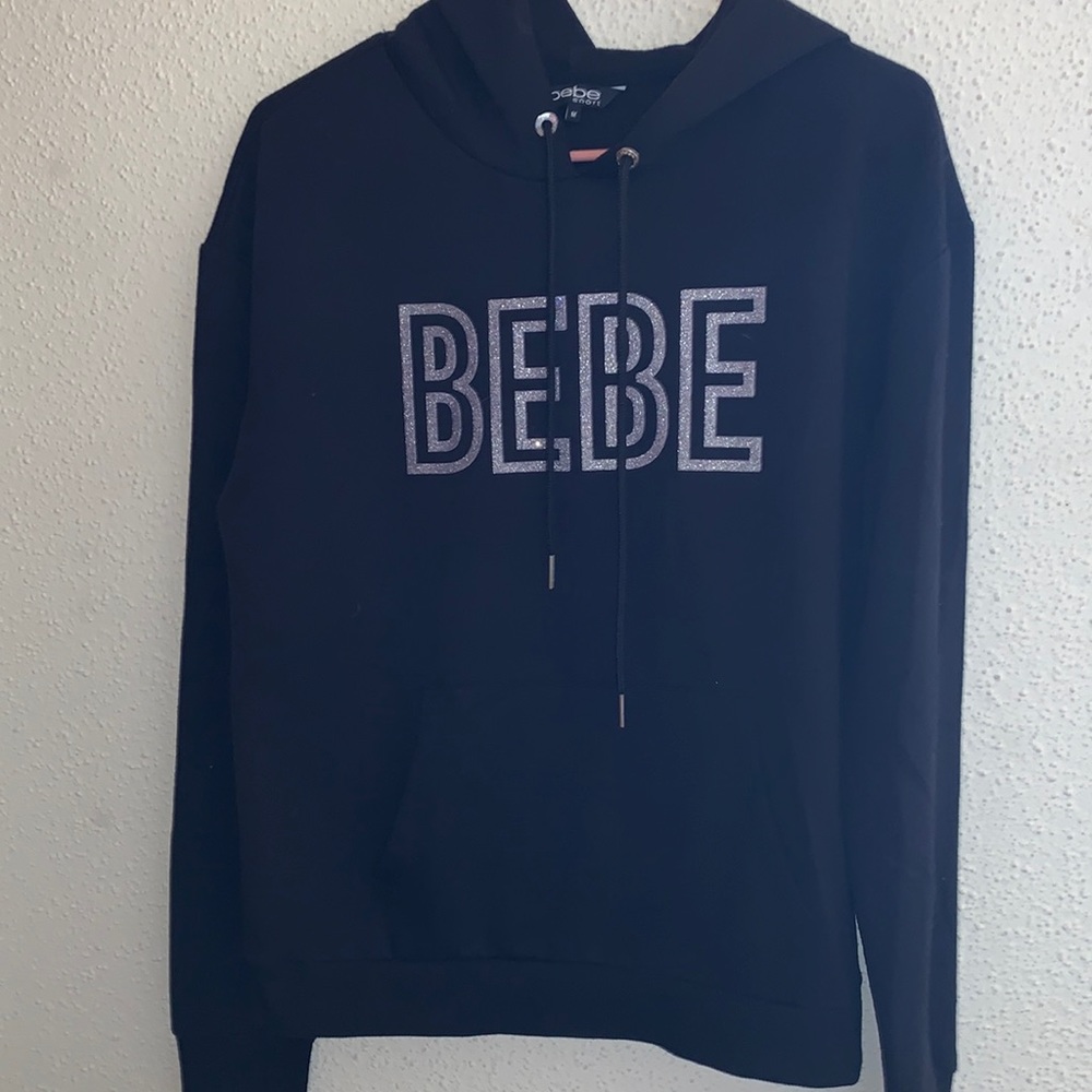 Black BEBE pull over, brand new without tags size medium.